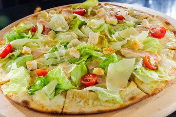 Pizza on table close up.Cut pizza.Italian traditional dish.