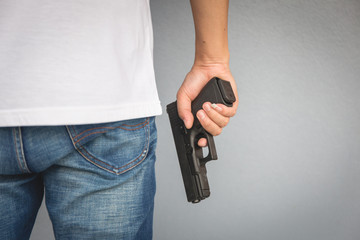 The man holding Pistol. Gun - 317916927