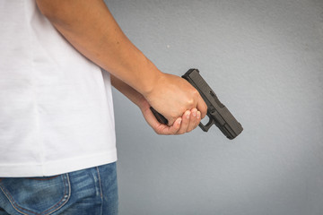 The man holding Pistol. Gun - 317916975