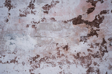 Old peeled brown wall. Texture on background