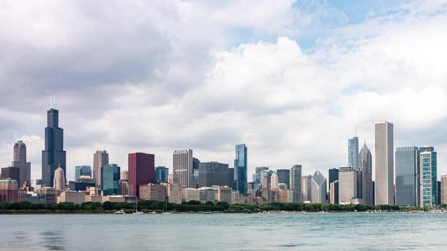 Time lapse of partly cloud skies flowing over the Chicago skyline and Lake Michigan on a summer day