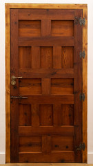 Spanish medieval farmhouse wooden door with panels and hinges