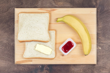Sweet sandwich with jam, banana and butter - recipe ingredients: heart shaped toast bread, strawberry jam and fruits. Step by step instructions. Set photo 01 of 5