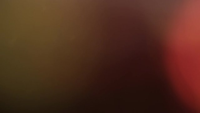 Abstract light leaks on black background.