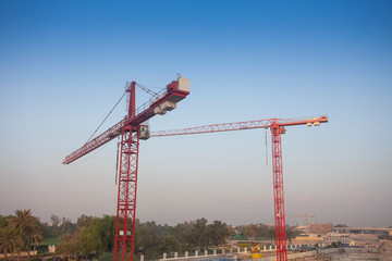 silhouette of construction cranes, industrial photo