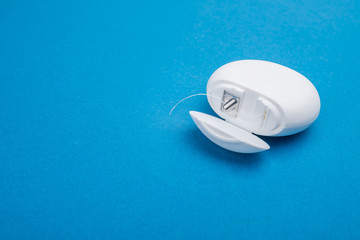dental floss on a colored background