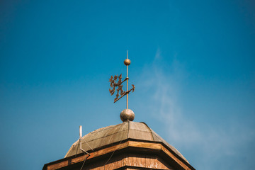 Grodno, Belarus. Close Up Of Weather Vane On Roof Of Old Fire Lookout Tower. Lookout Tower At Zamkovaya Street
