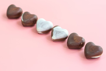 chocolate heart shape Valentine's day on pink background for texture