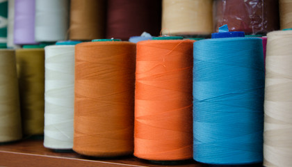 Multi-colored bobbins of sewing thread