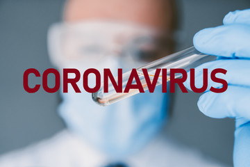 Coronavirus Researcher holds test tube with coronavirus virus, analysis and medicine to fight the...