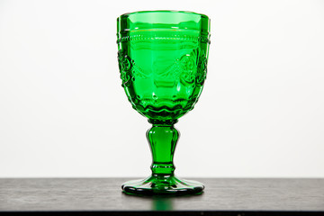 Glass with green drink.