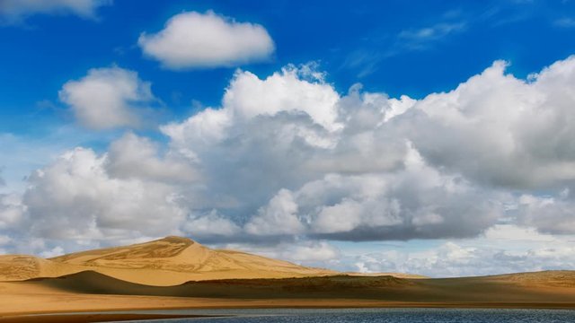 Clouds movig over Barkhans in Mongolia sandy dune desert Mongol Els. Khovd province, Western Mongolia.