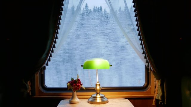 interior of a retro train car. view from the compartment of the car in the window. focus outdoor
