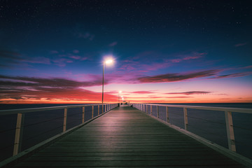 Fototapeta na wymiar Sunset over Grange jetty, Adelaide, South Australia