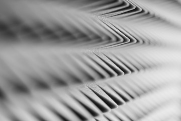 Grey acoustic foam pyramid repeating background for music Studio. Black and white. Close-up view...