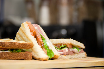 club sandwiches served on a wooden chopping board
