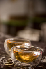 Green tea in glass small piala cup on table