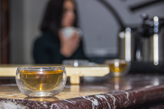 Green tea in glass small piala cup on table