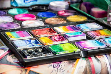 Bright colors for make-up. Many multi-colored visage paints