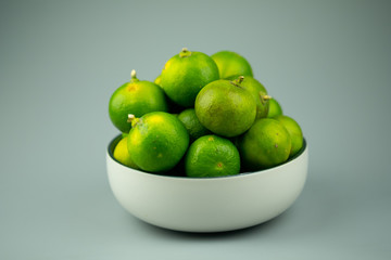 Fresh green limes. Food ingredient for sour taste.