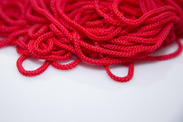 red threads on white background close-up	