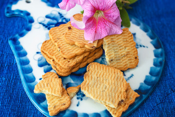 tasty cookies and petunia flower