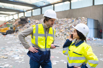 recycling plant worker wearing hardhats