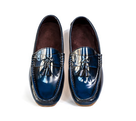 Men fashion tassel loafer shoes with blue polished leather isolated on white background.