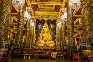 Background of religious tourist attractions, the old Buddha Church (Phra Buddha Chinaraj National Museum), with both Thai and foreign tourists coming to make merit always in Thailand.