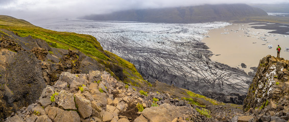 Panoramic view over Skaftafellsjokull glacier and tourists, a wander near Skaftafell on South Iceland, summer