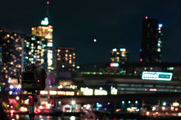 A view of the night Melbourne. Quay in Docklands, view from the bay to the skyscrapers. A camera on...
