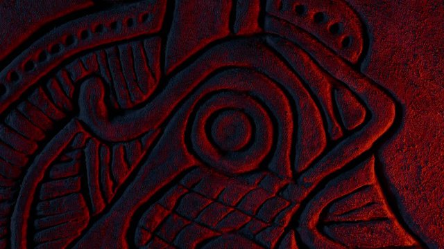 Detail Of Viking Carving Dragon In Firelight