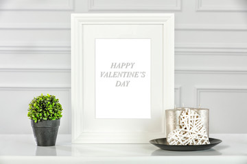 Fototapeta na wymiar White wooden table with white wall background and free space for your decoration.White wooden frame and copy space of Valentine's Day 