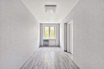 Empty room after repairs in an apartment building