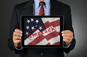 Politician Holding Tablet with American Flag and the Word Impeach