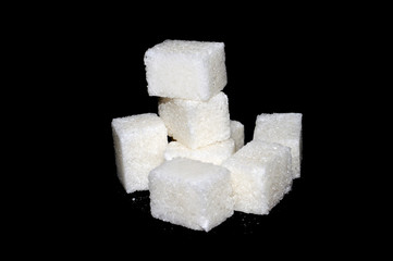 sugar cubes isolated on black background