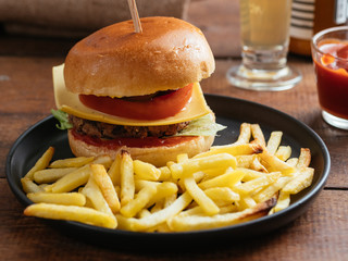 Home made black bean and walnut burger with french fries.