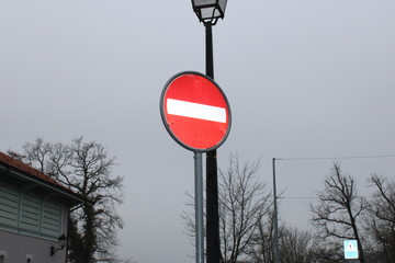 wrong way sign with glare