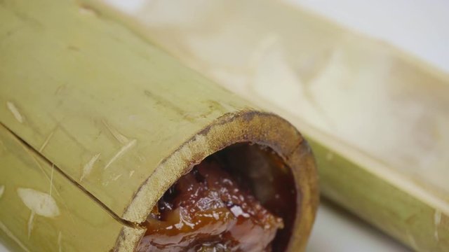 Sticky rice fried in bamboo seams with coconut milk and beans. Brown glutinous rice, a national dish. The Thai name is Khao Lam.
