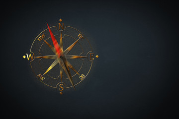 Gold colored compass design on black background. Explore the world concept. 