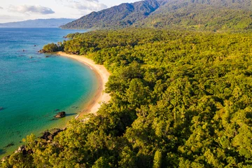 Foto op Canvas Aerial view of remote beach squeezed between coral reef and primary rainforest, Tampolo, Masoala National Parl, Madagascar © Reto Ammann
