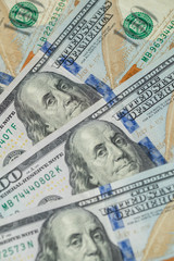 Pile of one hundred US dollar bills. United States 100 dollar bills. One hundred American dollars. United States currency.