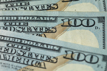 Pile of one hundred US dollar bills. United States 100 dollar bills. One hundred American dollars. United States currency.