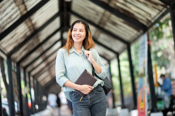 Happy young Asian University student.