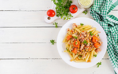 Italian pasta, penne with minced meat, chickpeas and pumpkin. Healthy food. Pasta with forcemeat. Top view, overhead