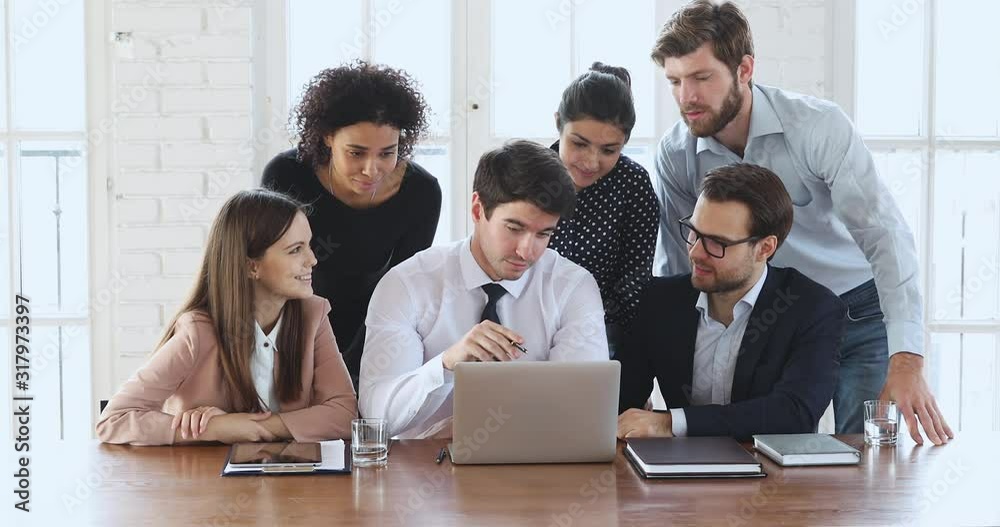 Poster diverse ethnicity employees group discussing digital data on laptop