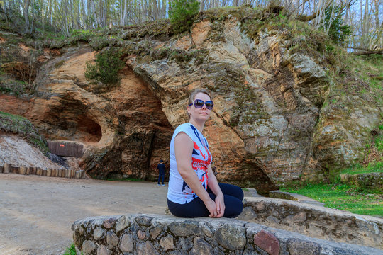 Sigulda of Vidzeme Region of Latvia: Woman in a T-shirt of the English flag walks through the territory of the Turaida Museum Reserve