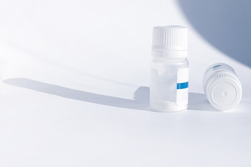 Yogurt starter cultures in medicine bottle on white background. Lactobacillus bulgaricus, Streptococcus thermophilus. Ferments lactose milk sugar, lactic acid produce. Homemade fermented milky drinks.