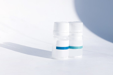 Yogurt starter cultures in medicine bottle on white background. Lactobacillus bulgaricus, Streptococcus thermophilus. Ferments lactose milk sugar, lactic acid produce. Homemade fermented milky drinks.