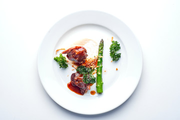 Meat and asparagus. Set Food Menu On A White Plate. Top view of light dish perfect served. 